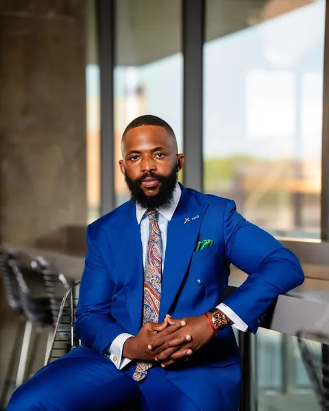 Charles Okpala, portrait, blue suit